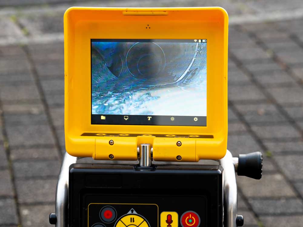 Video monitor showing interior of drain line during inspection